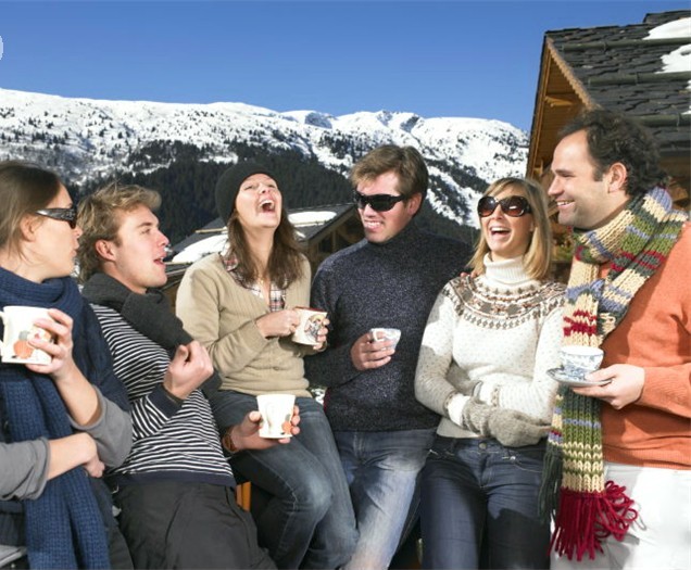 Group of friends on terrace at mountains