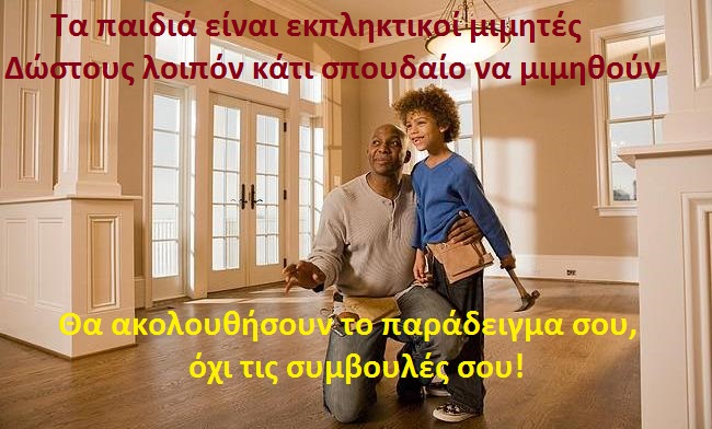 African father and son wearing tool belts